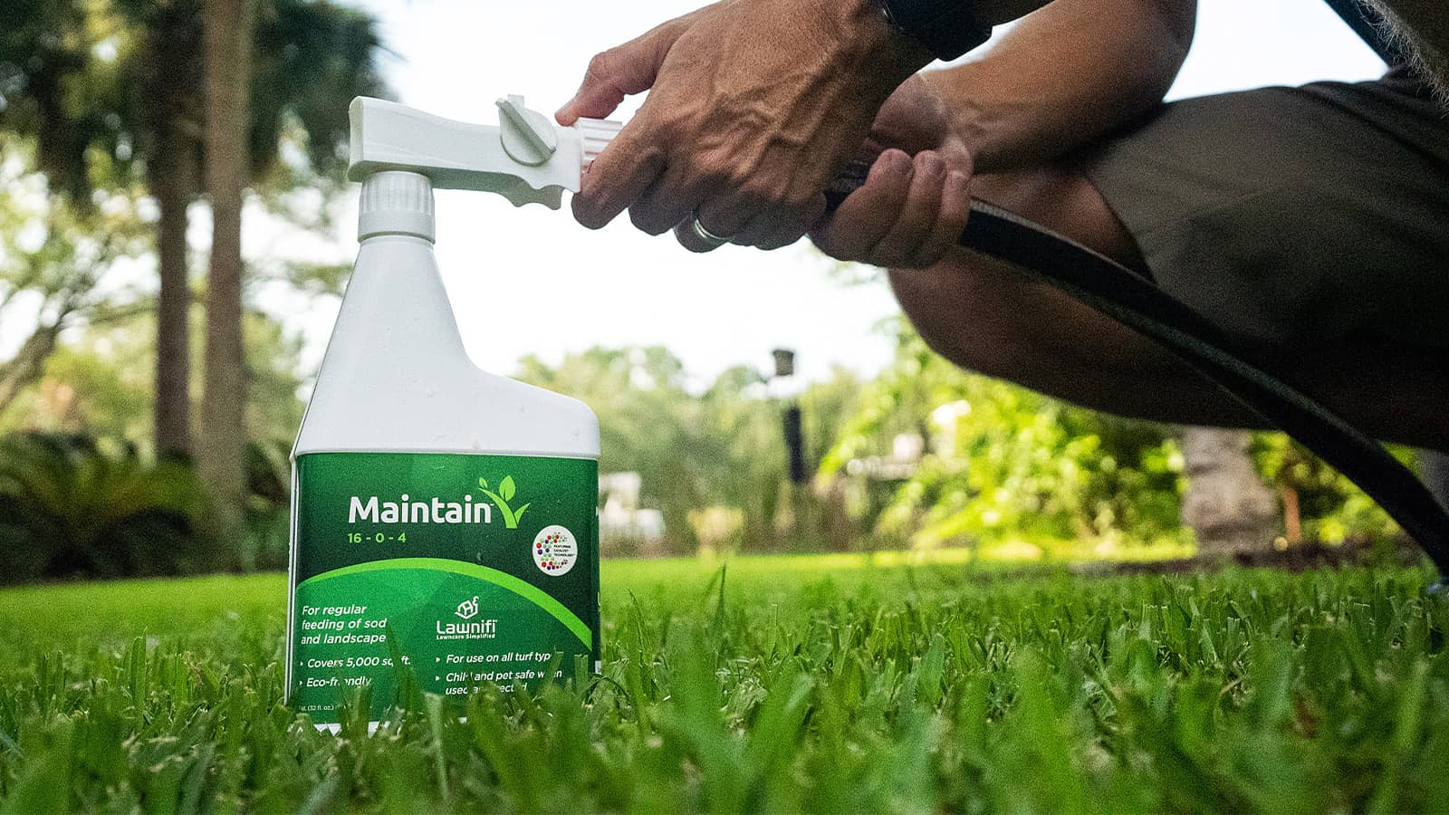 Lawnifi Maintain Bottle Connecting To Hose On Grass Lawn