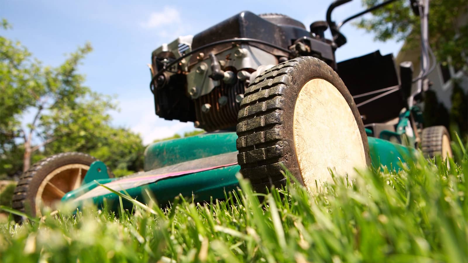 Close Up Of Lawn Mower On Grass Front Angle