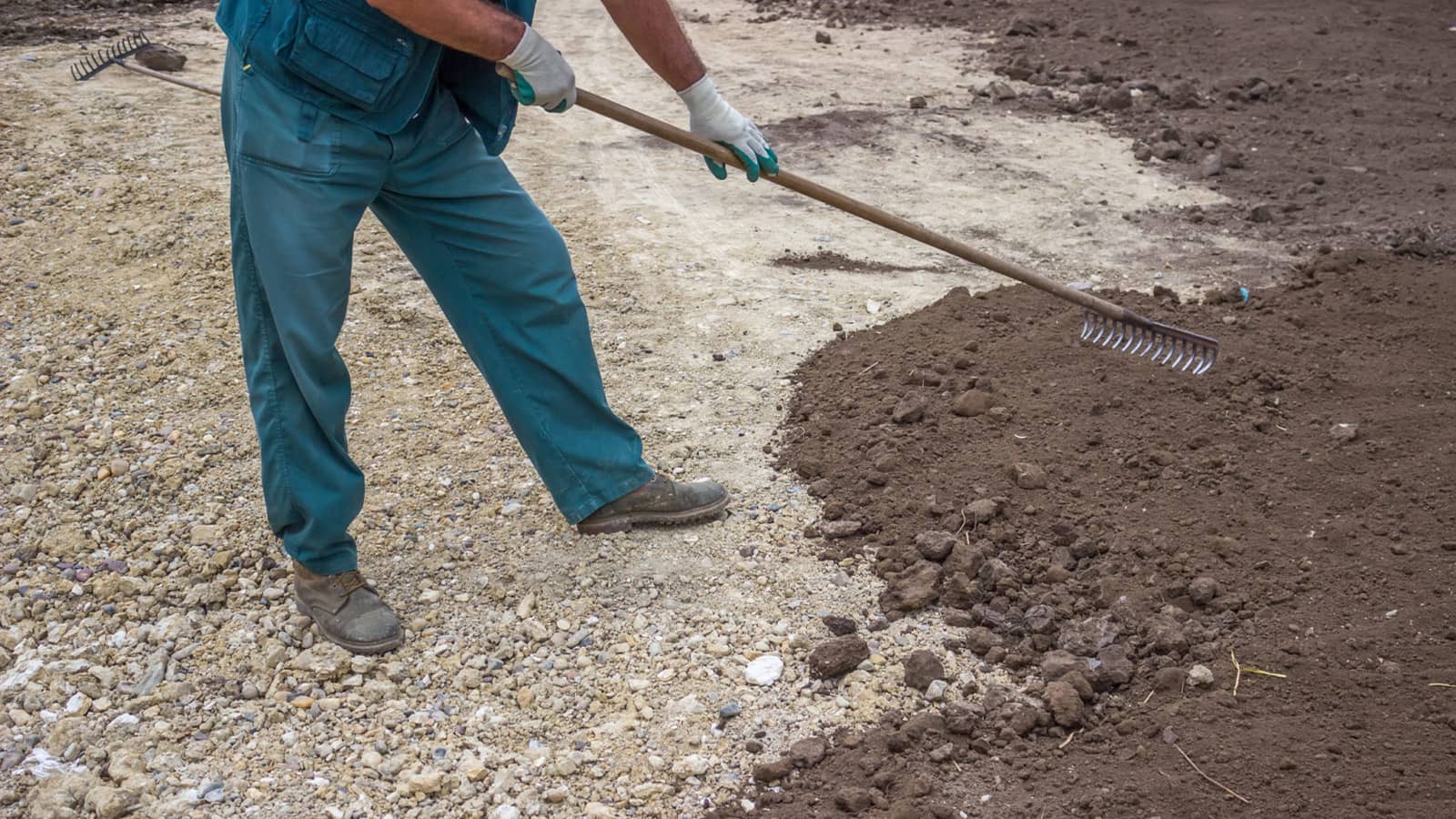 Man Leveling Soil